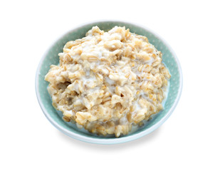 Bowl with tasty oatmeal on white background