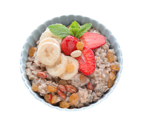 Bowl with tasty oatmeal, sliced banana and strawberry on white background