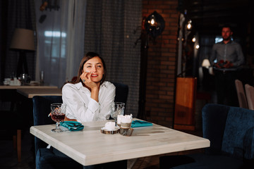 a beautiful girl is waiting for a guy on a date