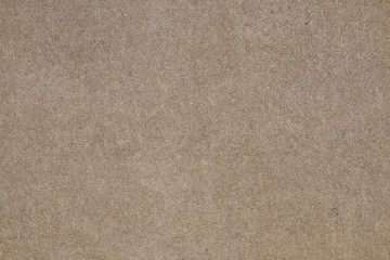 Fototapeta na wymiar Brown concrete floor texture with small dash pattern. Close-up photo of scabrous background. Horizontal orientation