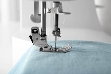 Sewing machine with fabric, closeup