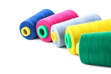 Color sewing threads on white background