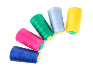 Color sewing threads on white background