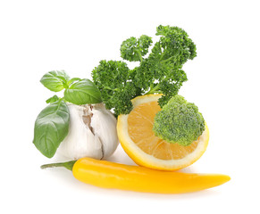 Fresh lemon, herbs and spices on white background