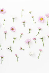 Floral pattern with tender pink and white flowers arranged as a flatlay on white background