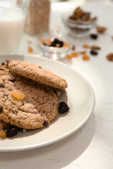 Fototapeta premium Plate with delicious oatmeal cookies on white table