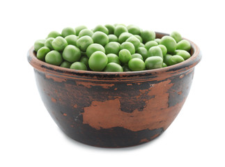 Bowl with green peas on white background