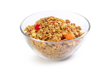 Bowl of homemade granola with fruit pieces isolated on white