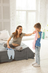 Laughing woman. Laughing pregnant woman feeling simply unforgettable while spending free time with...