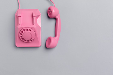vintage phone on color background