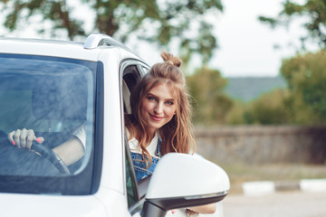 Trendy girl traveling by car