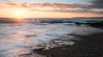 Beautiful dramatic Sunset over a rocky coast