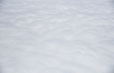 Nature background from white fluffy clouds