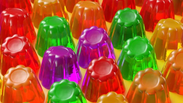 Seamless animation of multiple colorful jellies shaking. Tasty Jello desserts.