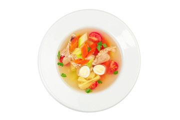 Homemade chicken vegetable soup in a white bowl