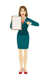 Businesswoman pointing on clipboard