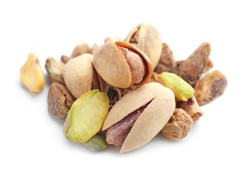 Tasty pistachio nuts on white background