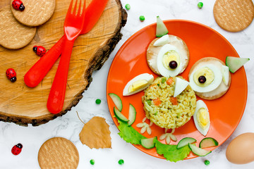 Halloween owl lunch for kids - boiled egg with rice and vegetables © san_ta