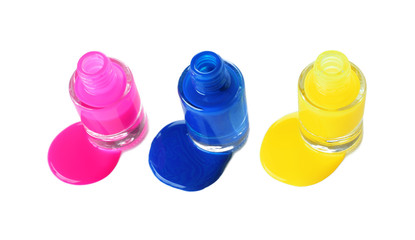 Open bottles of nail polish on white background