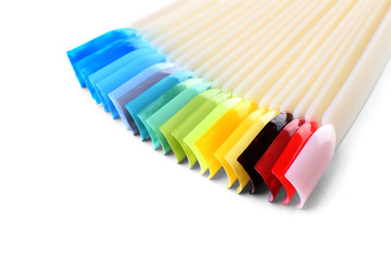 Colorful artificial nails on white background