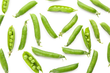 Pods with fresh green peas on white background
