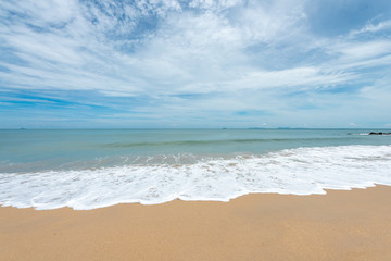 Fototapeta na wymiar Soft waves on the sand beach
