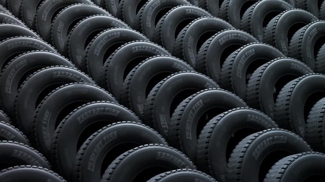 Endless stack of new car tires. Automotive modern manufacturing rubber.