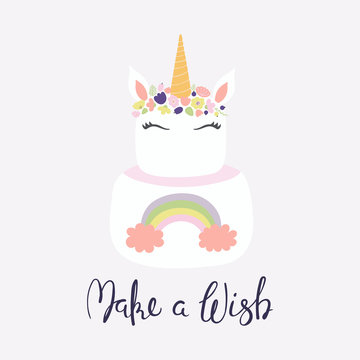 Hand drawn vector illustration of a cute funny unicorn cake with face, horn, ears, flowers, lettering quote Make a wish. Isolated on light background. Flat style design. Concept for children print.