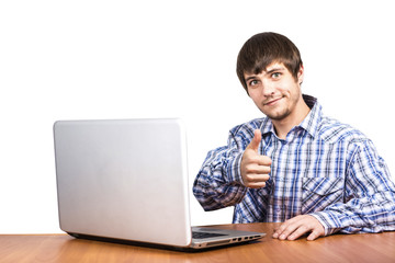 A young guy is working behind a laptop showing a hand like a white background on a white background