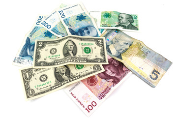 Multi currency banknotes with a men's wallet isolated