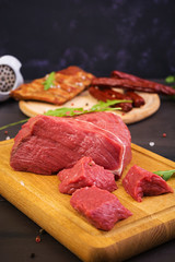 Raw meat. Fresh beef on wooden background
