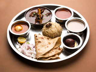 Motton Thali OR Gosht/Lamb platter is Indian/asian non veg lunch/dinner menu consists of meat, egg curry with chapati ,rice, salad and sweet Gulab Jamun