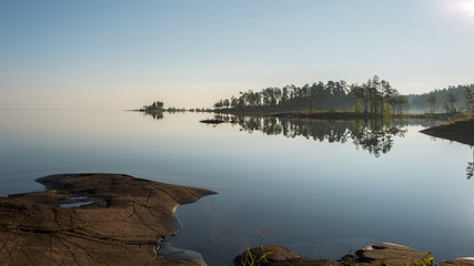 Not an irascible smooth surface of the lake in the morning