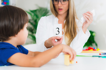 Child psychology, toddler doing logic tests with numbers