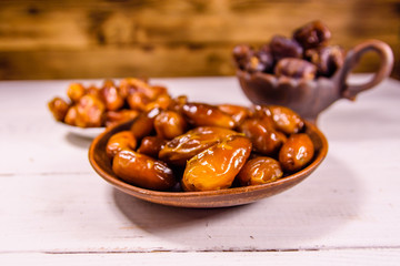 Date fruits on the white wooden table