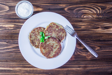 fried potato pancakes with sour cream