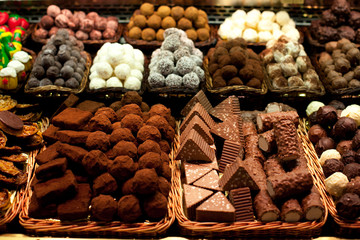 Famous sweet candy market .Confectionery at Boqueria market place in Barcelona, Spain. Assorted chocolate candy shop.