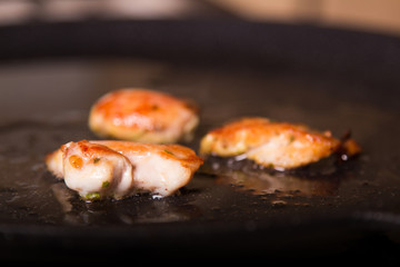 In the pan fried chicken pieces