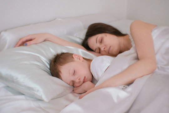 540px x 360px - Mom and son sleeping together. Mom hugging her son. Stock Photo | Adobe  Stock