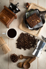 Obraz na płótnie Canvas coffee bean brownie with coffee pot on wood background
