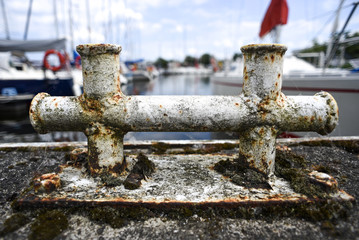 Old rusty bitt on the marina.