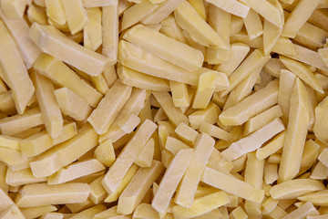 Freshly frozen semi-finished products. French fries. It is laid flat.