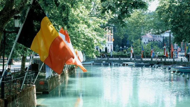 view on boats and flags at the lake in Annecy, France