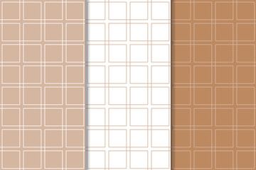 Brown and white geometric ornaments. Set of seamless patterns