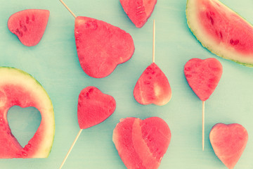 Fototapeta na wymiar Heart shaped watermelon on baby blue background