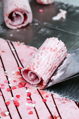 Thai roll ice cream is made by hand on the freezer. Sweet dessert made from natural berries and ingredients. The process of making food.