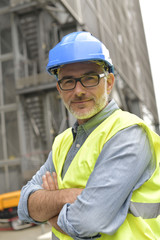 Industrial engineer standing in recycling plant