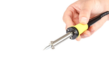 Soldering iron in a hand on a white background.