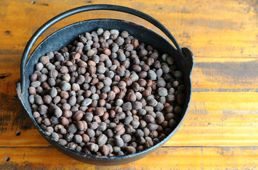 Unroasted coffee bean in vintage steel bucket