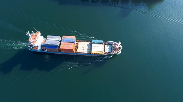 Small Container Cargo Ship. Aerial Top Down View
